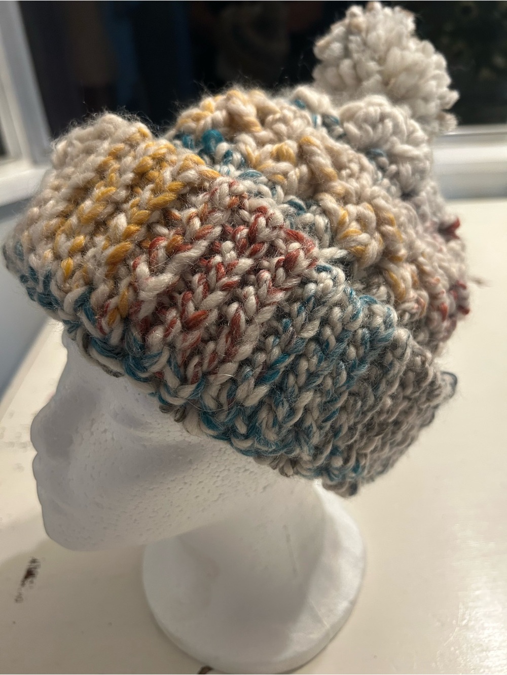 Women’s handmade winter hat multicolor with pom-pom